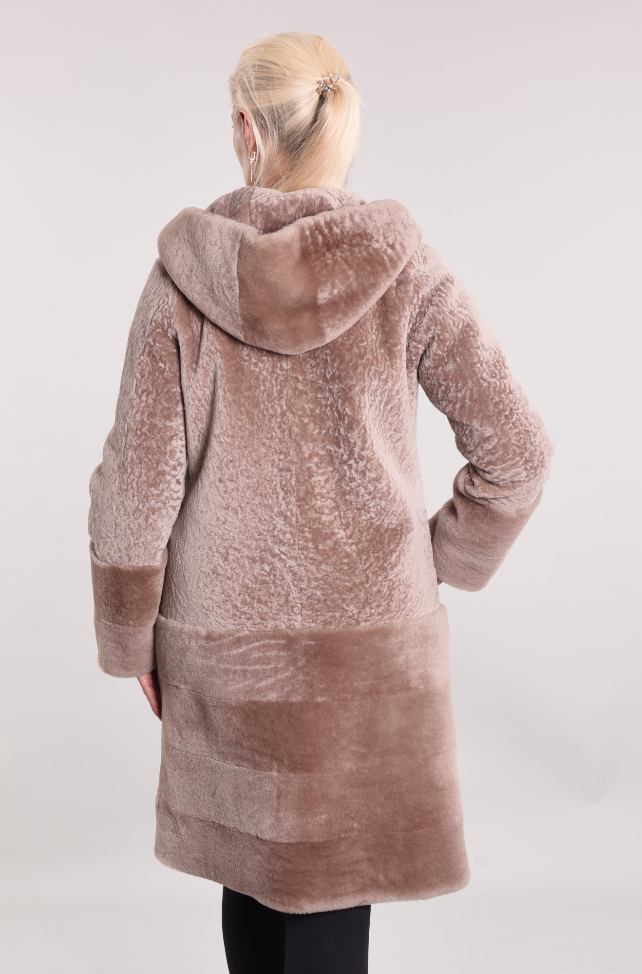 Astragan with a lining with a hood, cuffs and bottom of the product Mouton