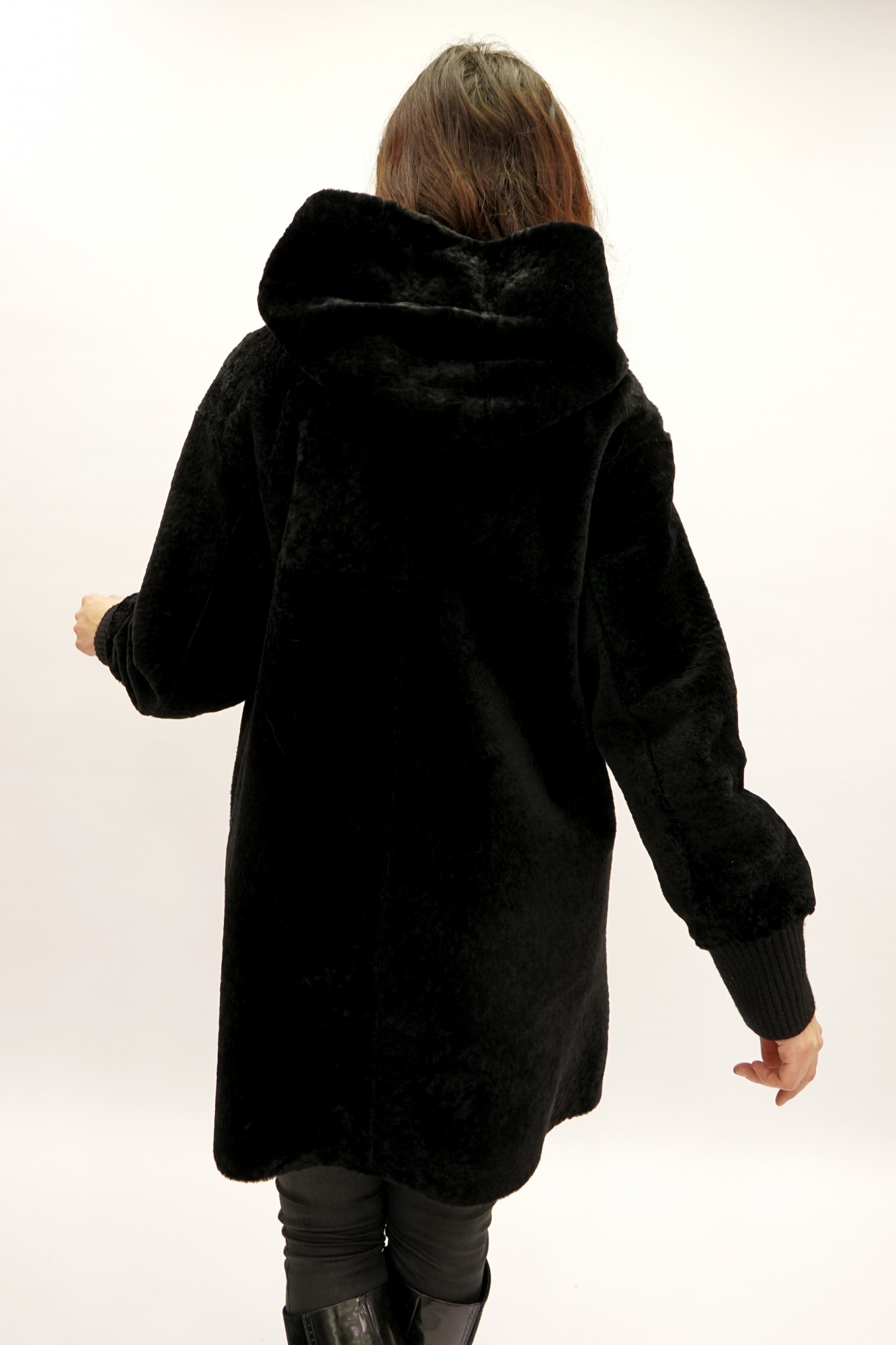 Astragan with a cover and a hood. Jersey cuffs and hem