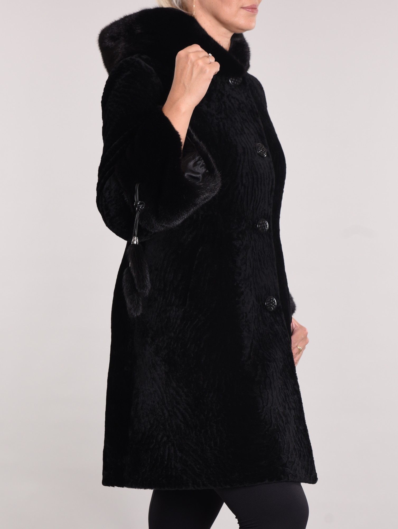 Astragan on the lining. Mink cuff and hood