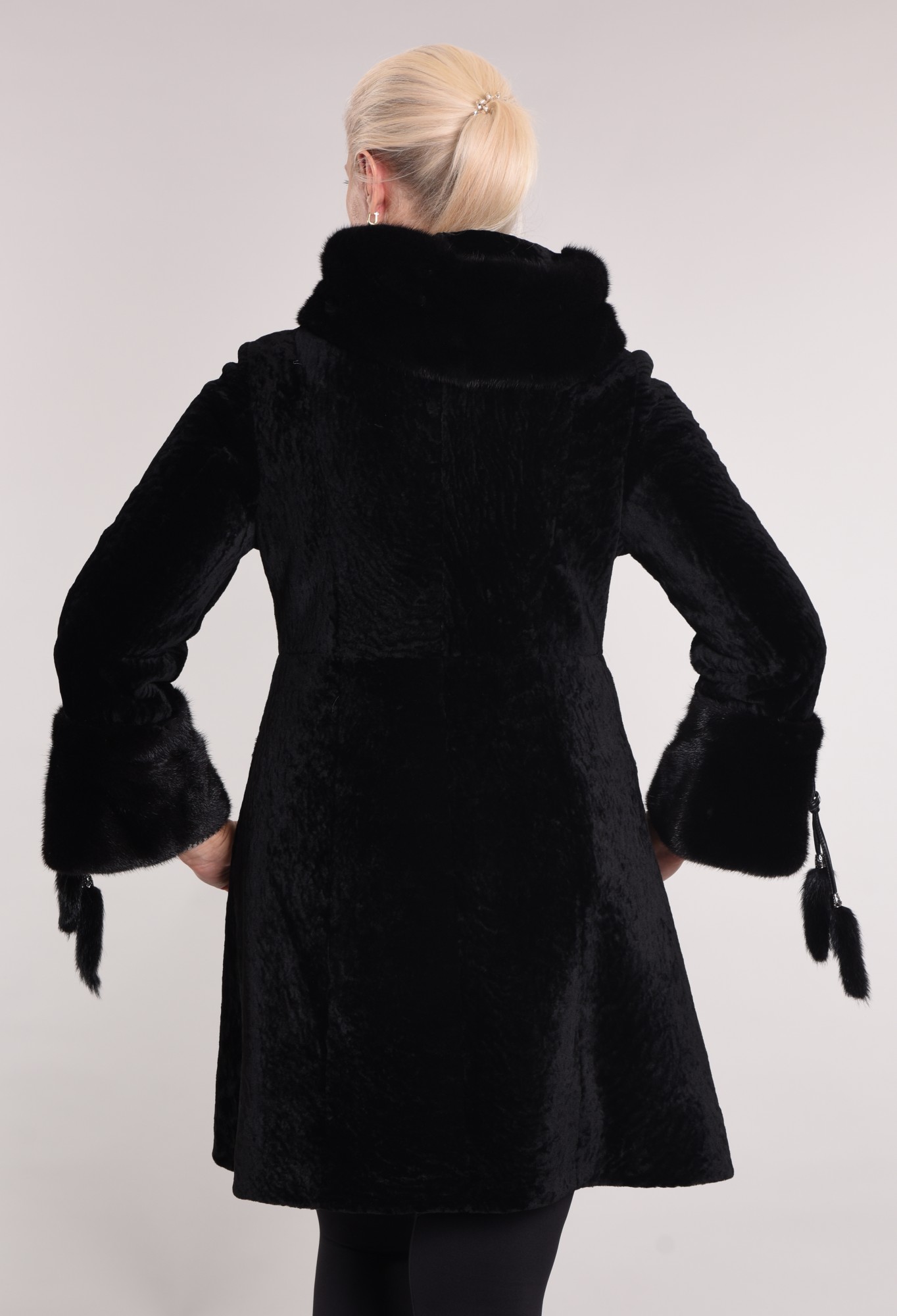 Astragan on the lining. Mink cuff and hood