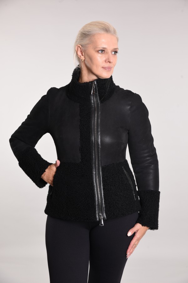 Coated sheepskin coat with curly elements